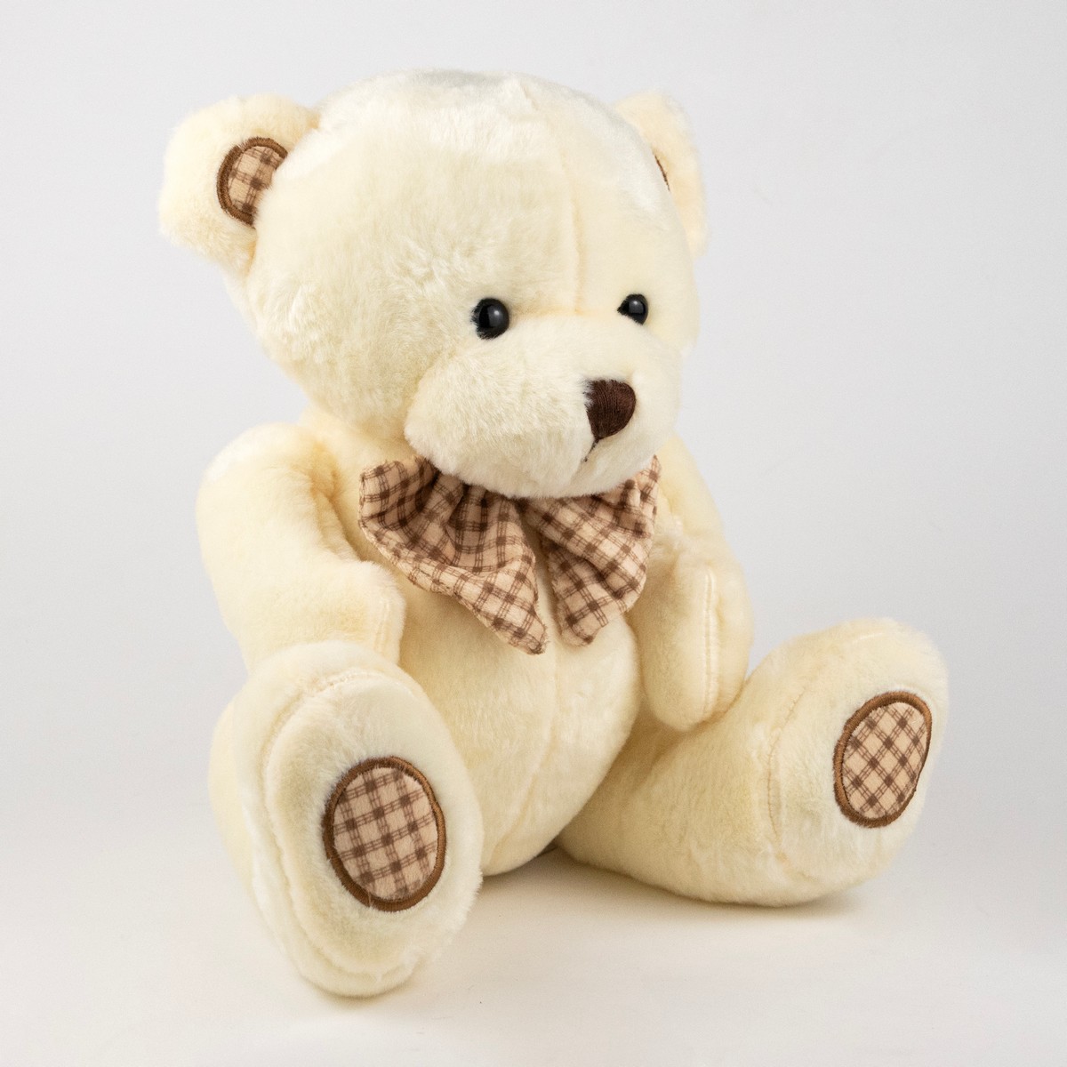 Игрушка м/н Медведь с бантом, 25см, крем. в интернет-магазине флористических аксессуаров Азалия Декор