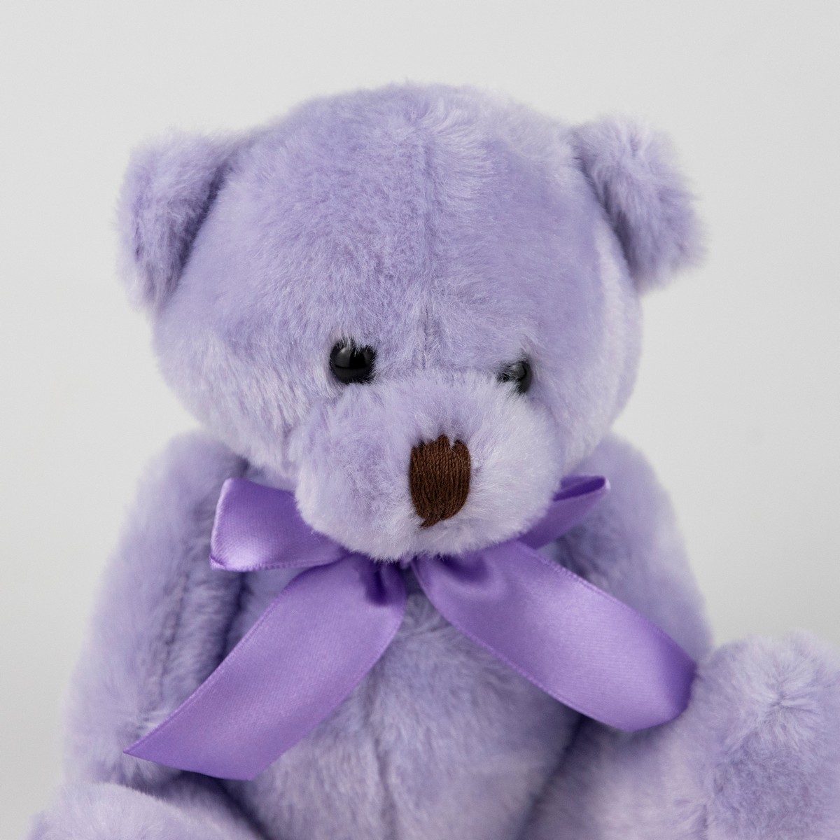 Игрушка м/н Медведь с бантом, 15см, светл.-сирен. в интернет-магазине флористических аксессуаров Азалия Декор